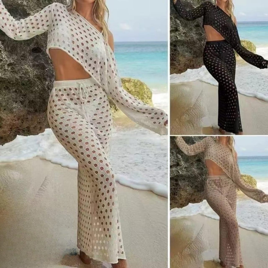 Woman in sheer polka dot outfit on a beach with ocean view